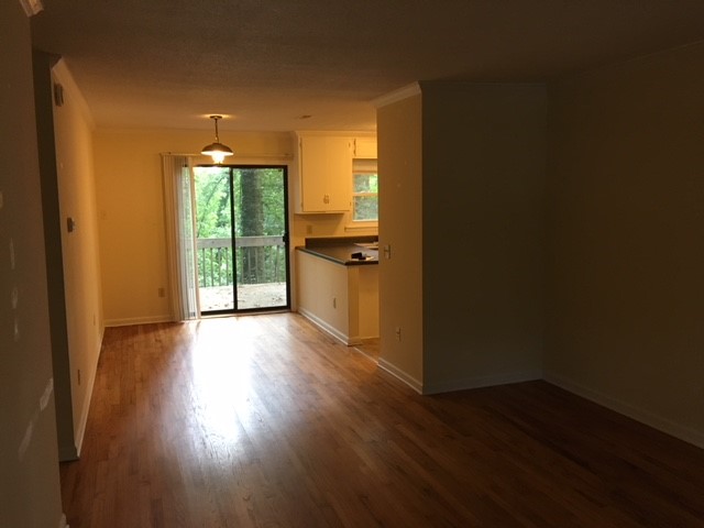 216 Lacustrian Lane, Unit 25 Central, SC 29630 - Photo 6 of 8 This inviting space features rich hardwood flooring and a serene patio view.