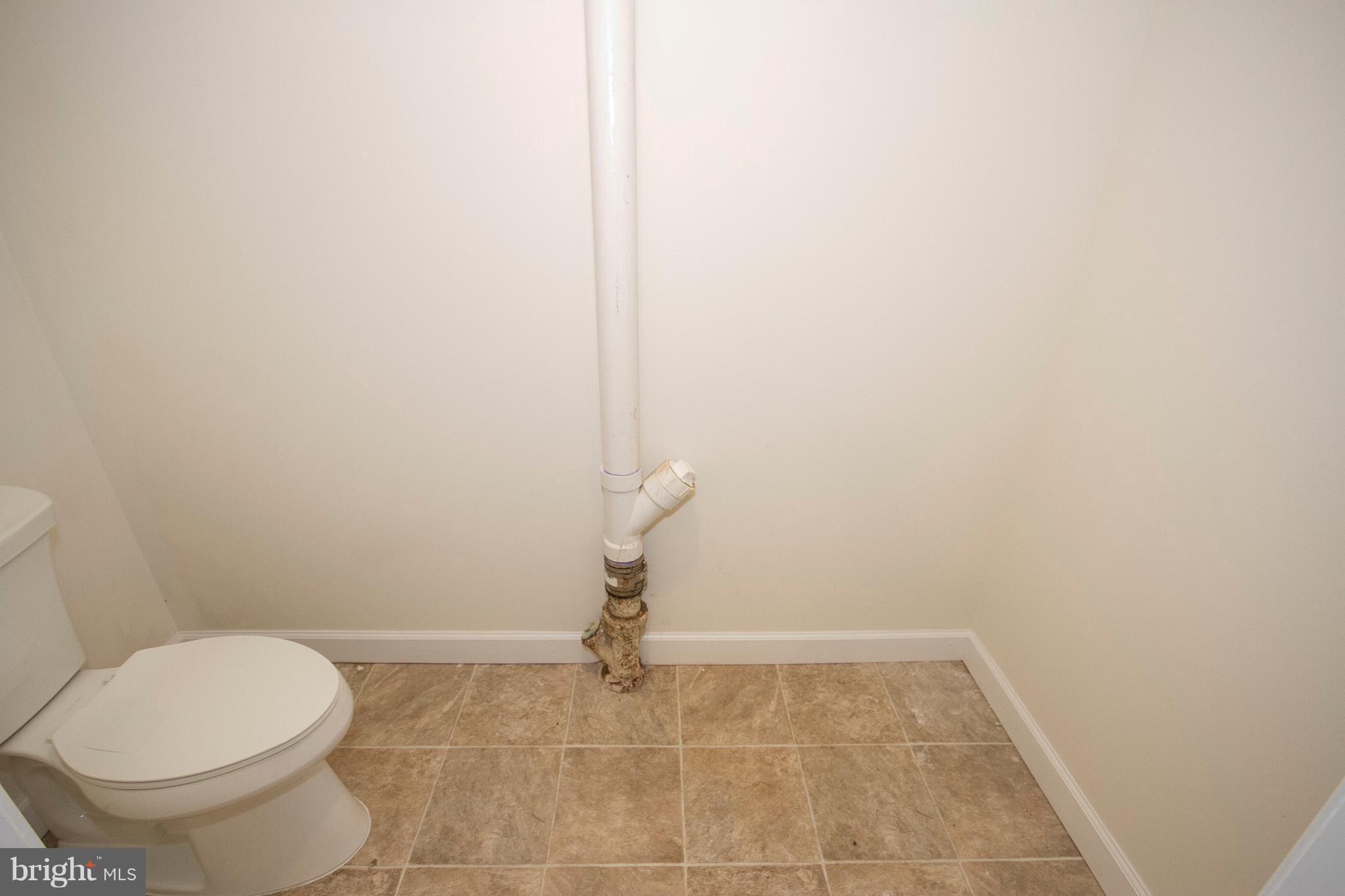 1381 Deanwood Road Baltimore, MD 21234 - Photo 15 of 27 a bathroom with a sink and a toilet