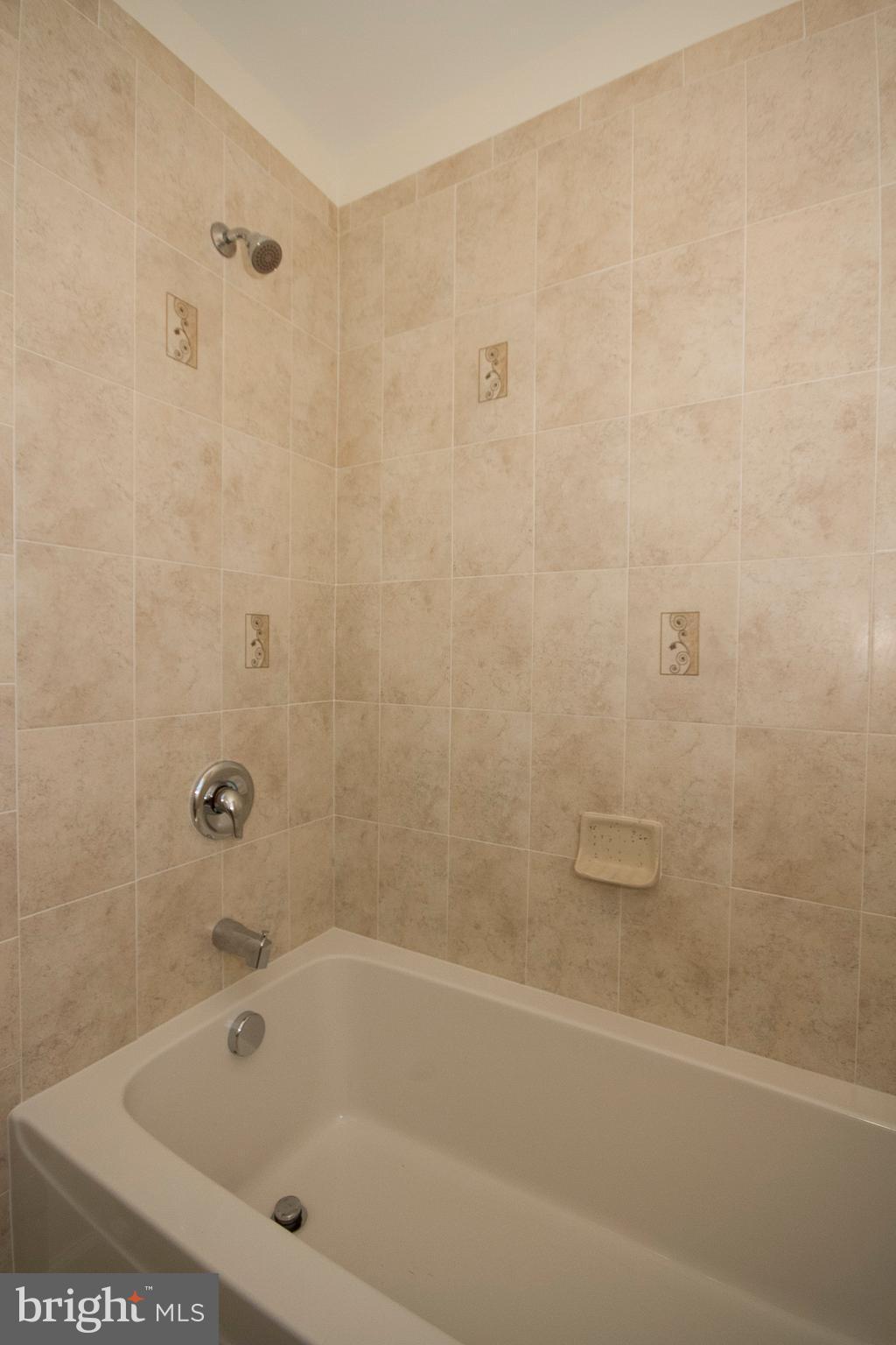 1381 Deanwood Road Baltimore, MD 21234 - Photo 23 of 27 a bathroom with a bathtub
