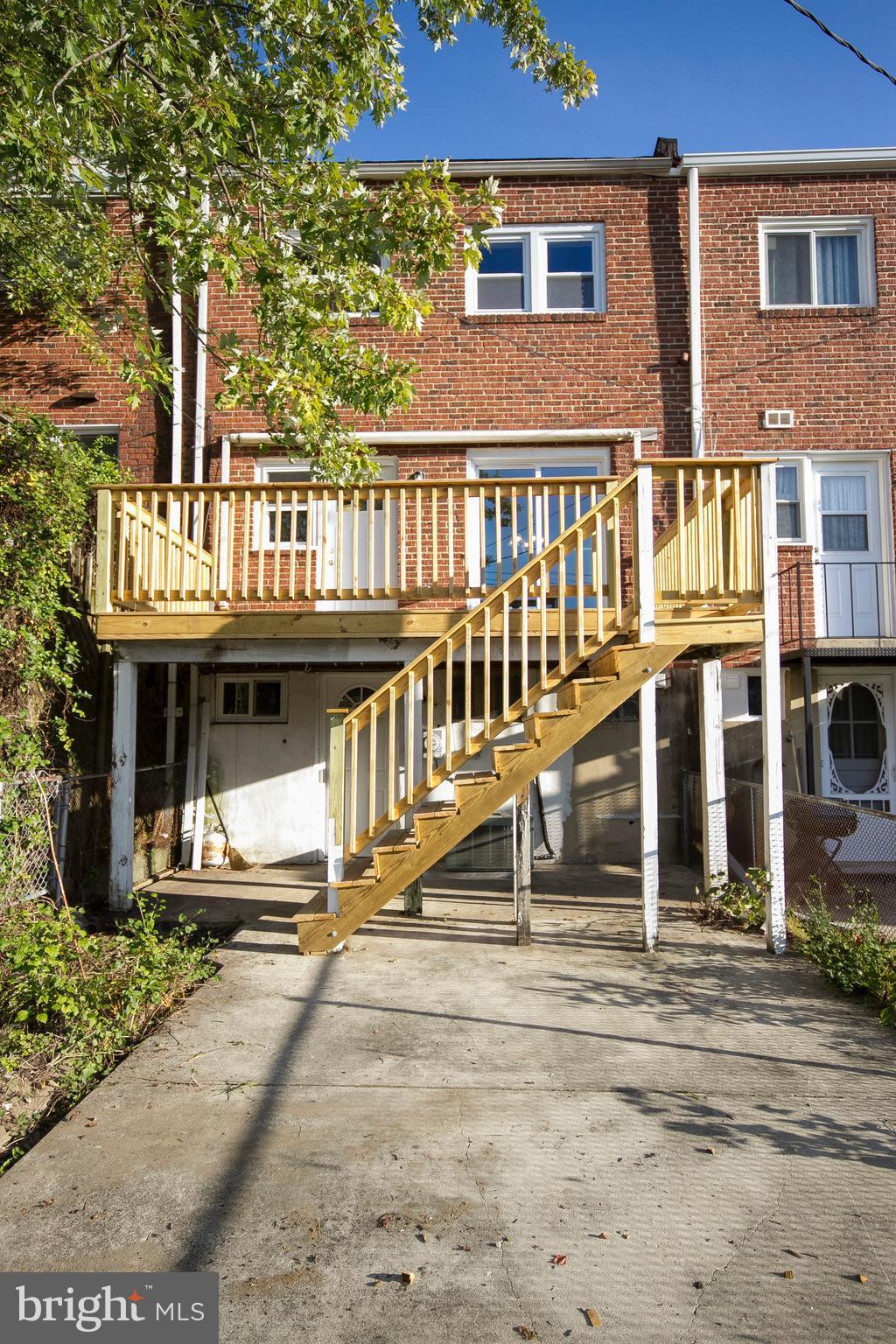1381 Deanwood Road Baltimore, MD 21234 - Photo 26 of 27 a view of a brick house with many windows