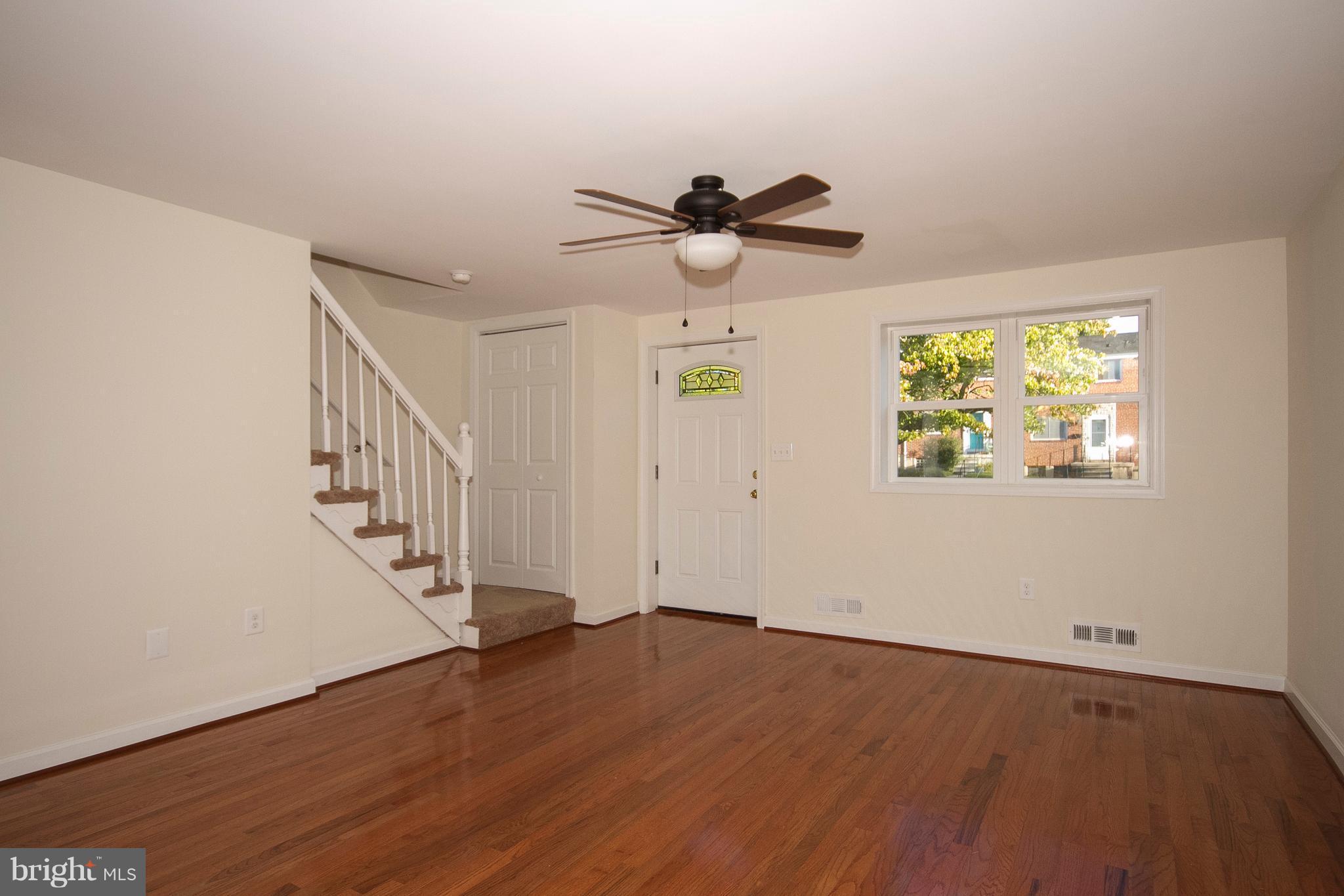 1381 Deanwood Road Baltimore, MD 21234 - Photo 4 of 27 a view of empty room with wooden floor and fan