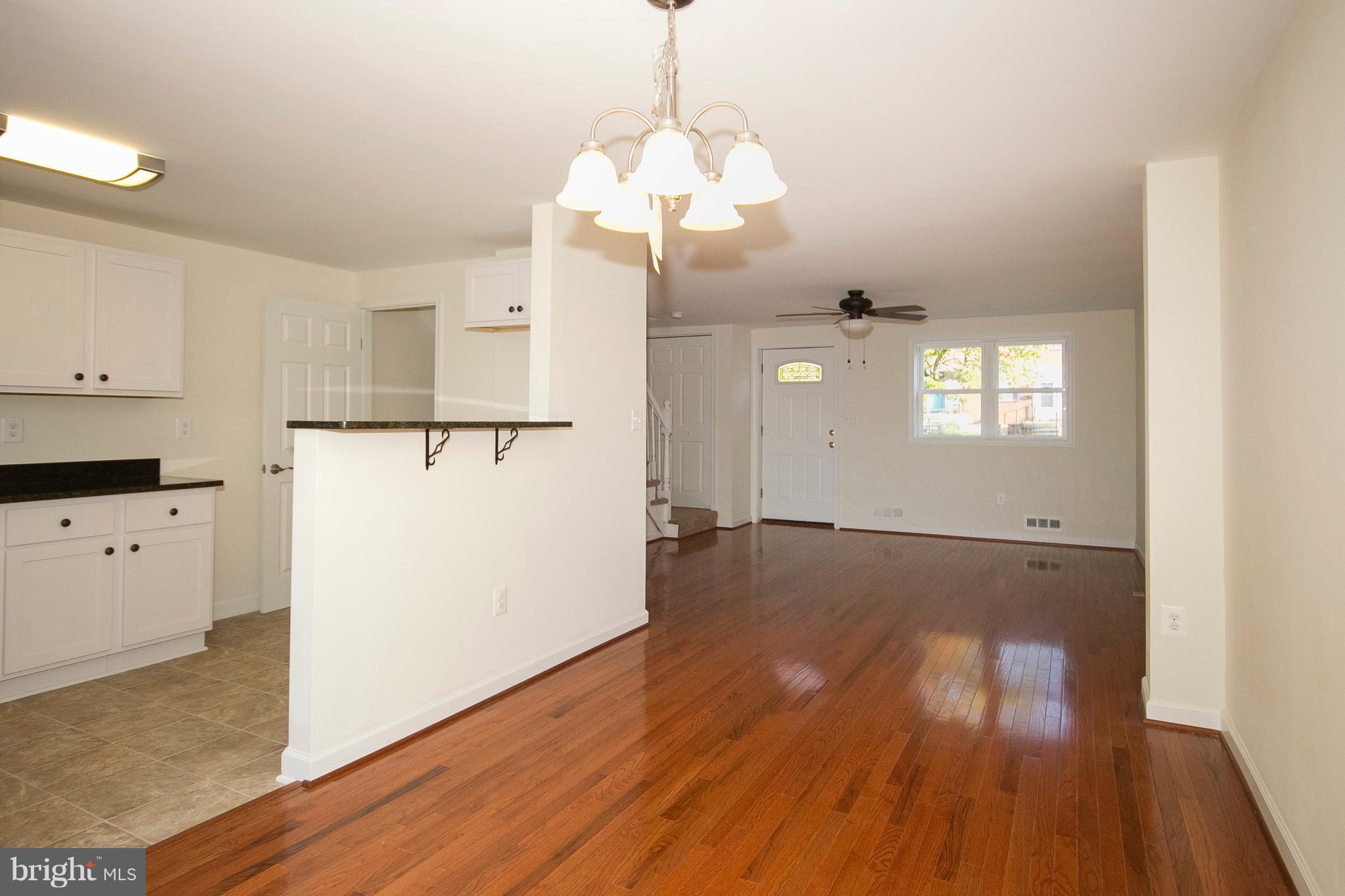 1381 Deanwood Road Baltimore, MD 21234 - Photo 7 of 27 a view of a kitchen with wooden floor and electronic appliances