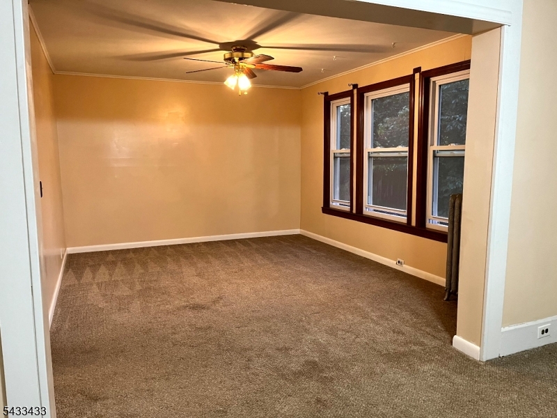 30 Fowler Street Franklin, NJ 07416 - Photo 13 of 27 an empty room with windows and fan