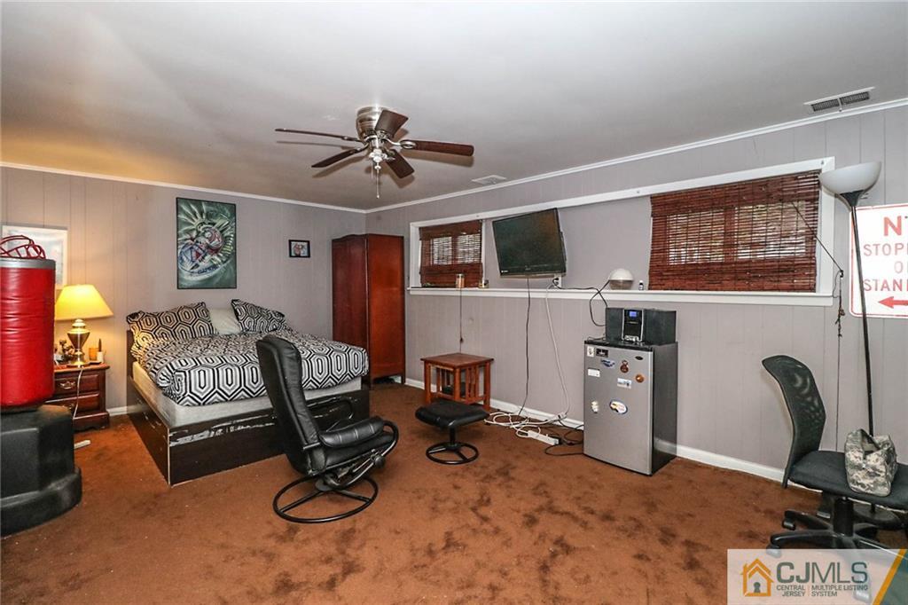 66 Harmon Road Edison, NJ 08837 - Photo 18 of 25 a view of a workspace with furniture and a window