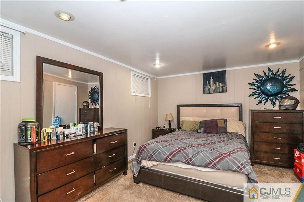 66 Harmon Road Edison, NJ 08837 - Photo 19 of 25 a bedroom with a bed and a dresser