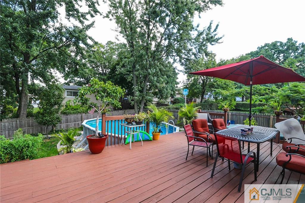 66 Harmon Road Edison, NJ 08837 - Photo 20 of 25 a view of a patio with furniture and yard