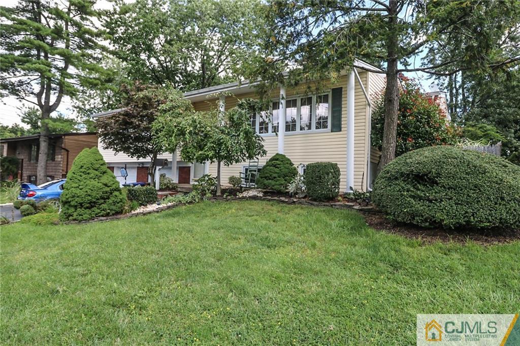 66 Harmon Road Edison, NJ 08837 - Photo 3 of 25 a view of a house with backyard and garden