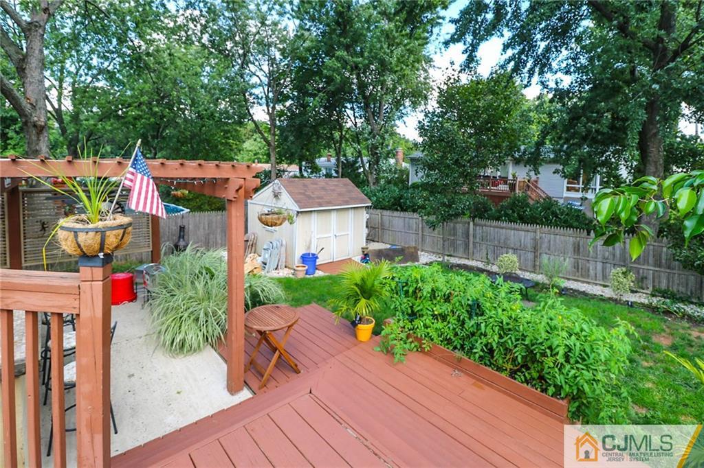 66 Harmon Road Edison, NJ 08837 - Photo 21 of 25 a view of a house with a backyard space