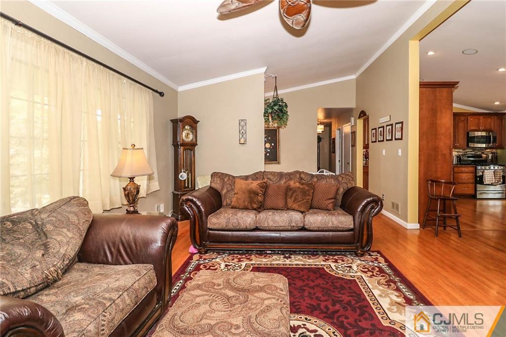 66 Harmon Road Edison, NJ 08837 - Photo 8 of 25 a living room with furniture and a large window
