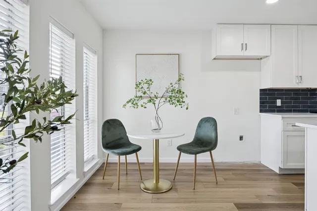 a bedroom with furniture and a potted plant
