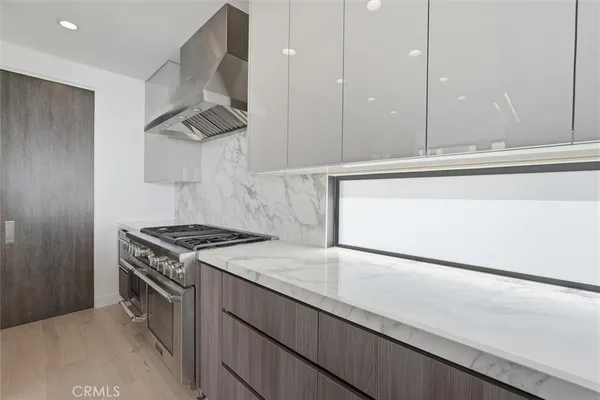 a kitchen with a stove and a sink