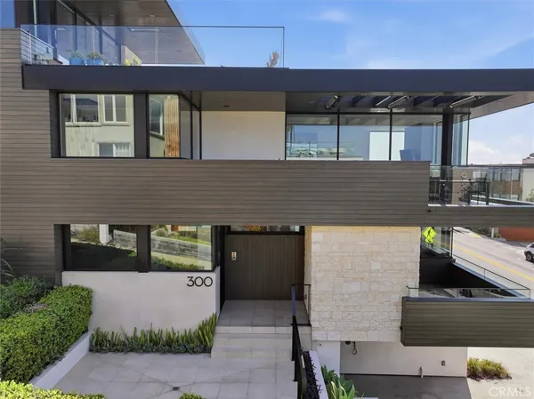 a front view of a house with garage