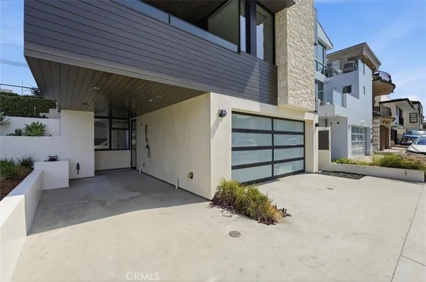 a front view of a house with a garage