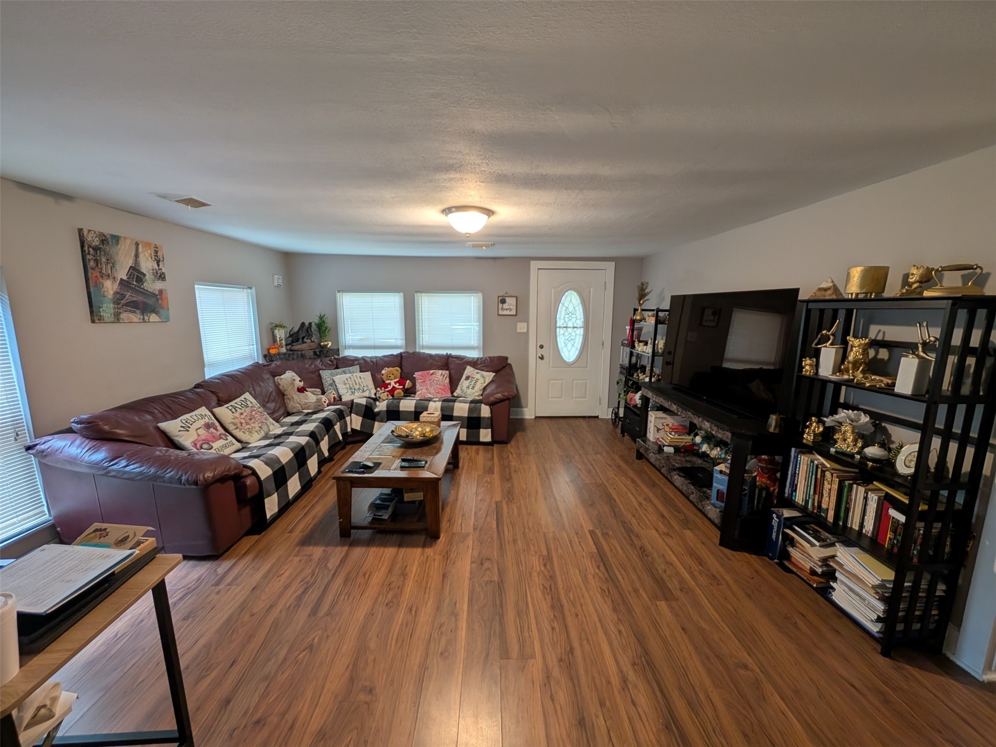 1910 Reese Street Liberty, TX 77575 - Photo 2 of 7 a living room with furniture and a flat screen tv