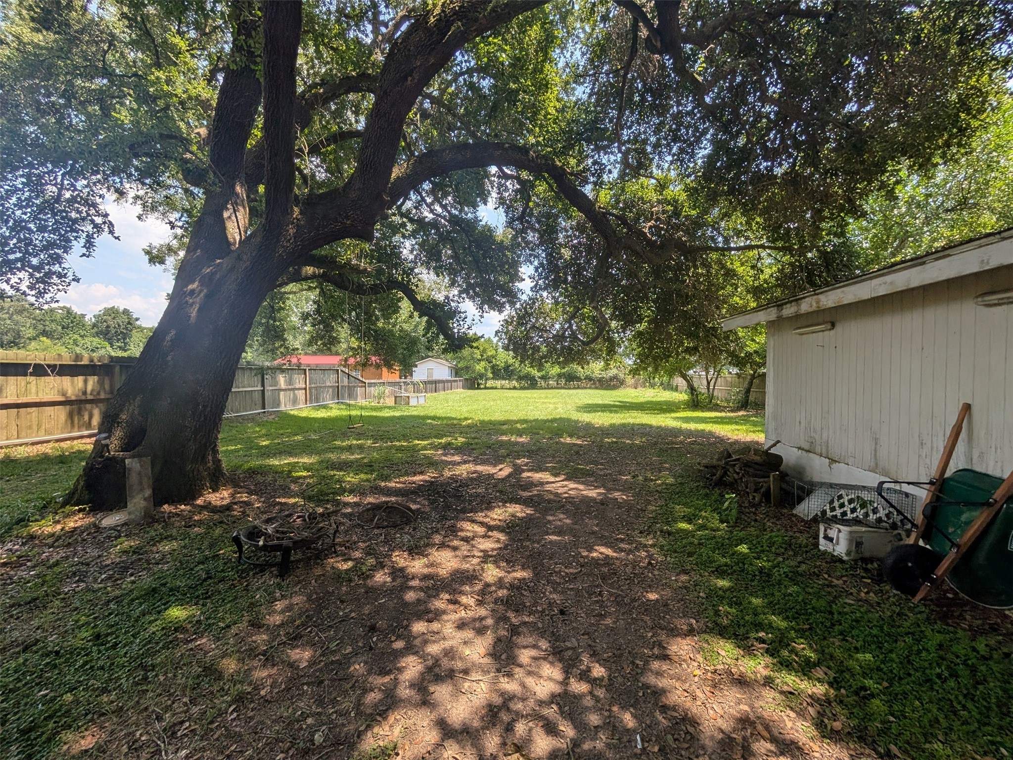 1910 Reese Street Liberty, TX 77575 - Photo 5 of 7 a view of a backyard with large trees