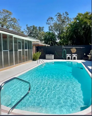 a house view with a sitting space and garden