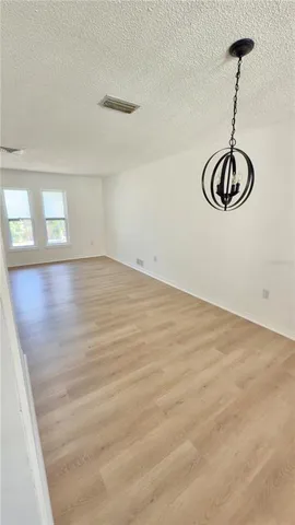 a view of a room with rack on the wall and a window