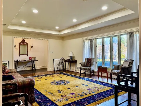 a living room with rug pool table and a table
