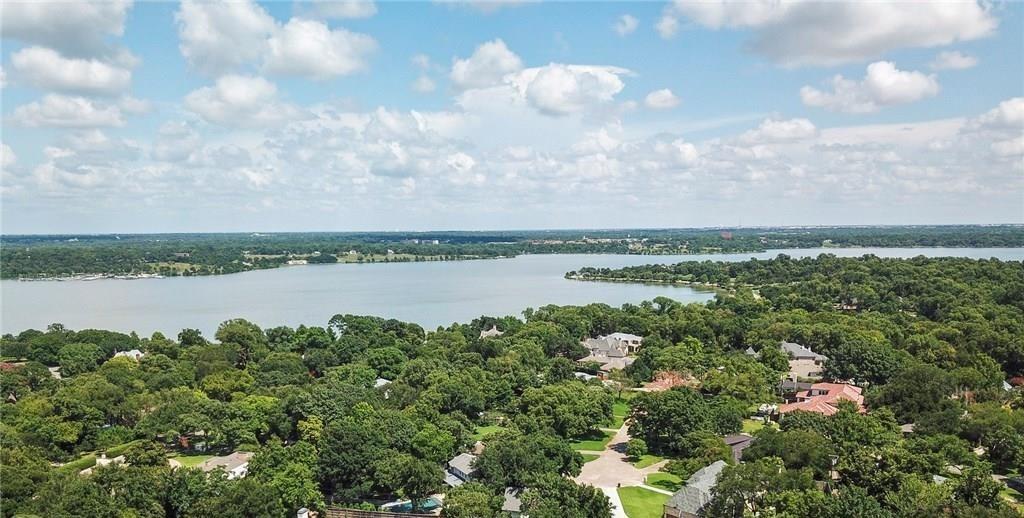 7141 Twin Tree Lane Dallas, TX 75214 - Photo 4 of 4 a view of a lake from a yard