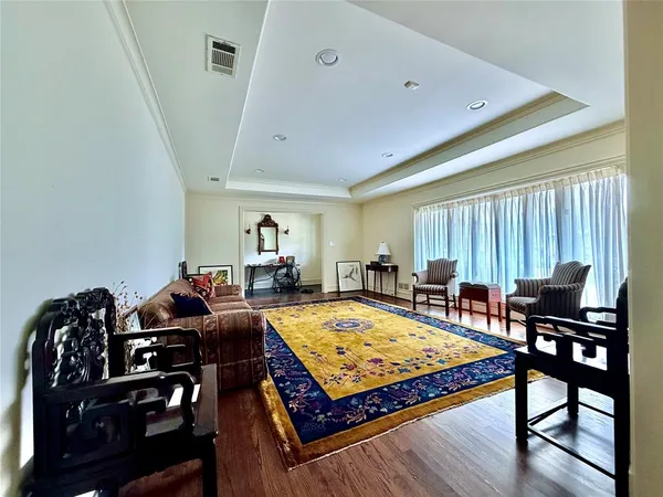 a living room with furniture pool table and a window