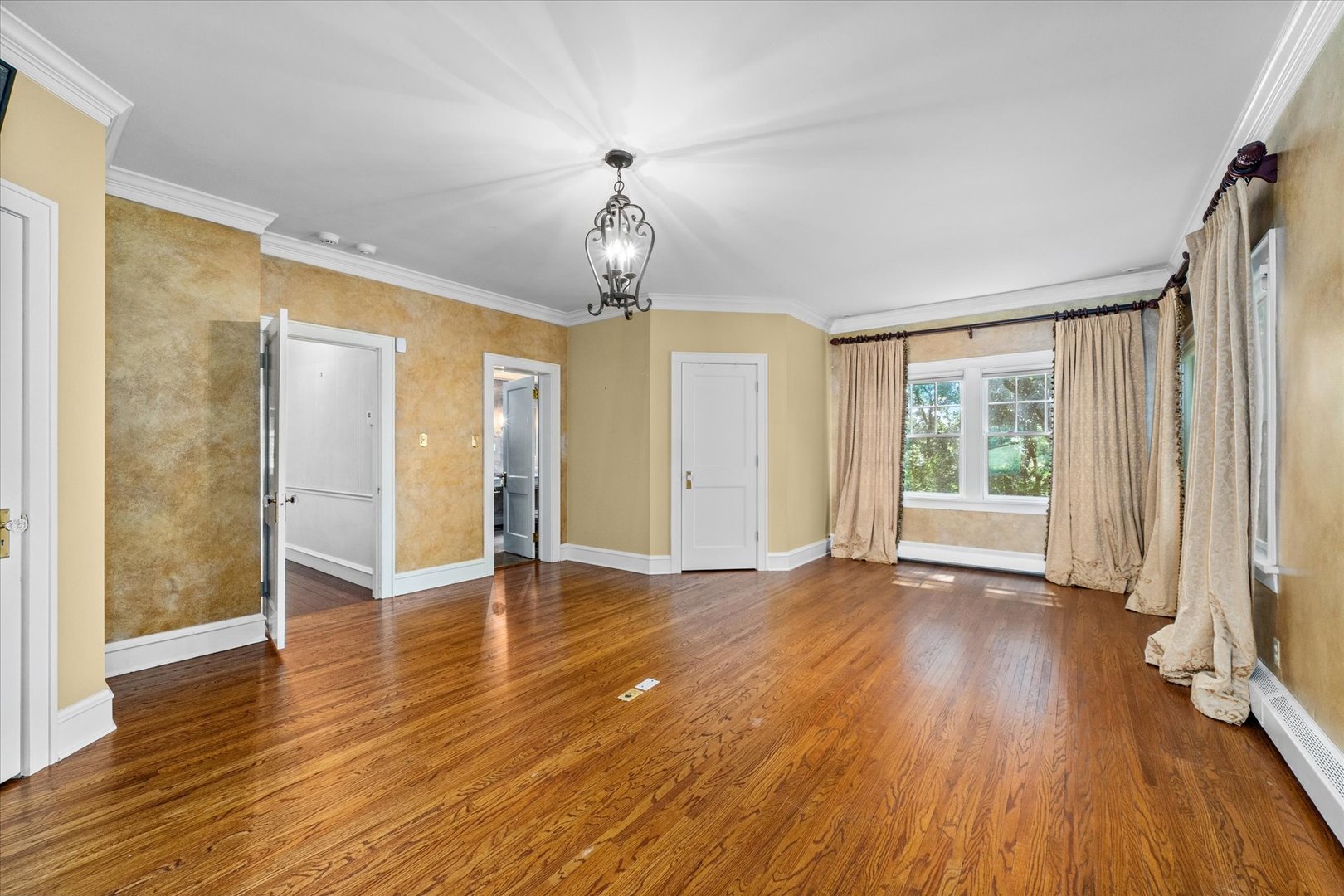 37-w025 Crane Road St. Charles, IL 60174 - Photo 13 of 32 a view of an empty room with wooden floor and a window