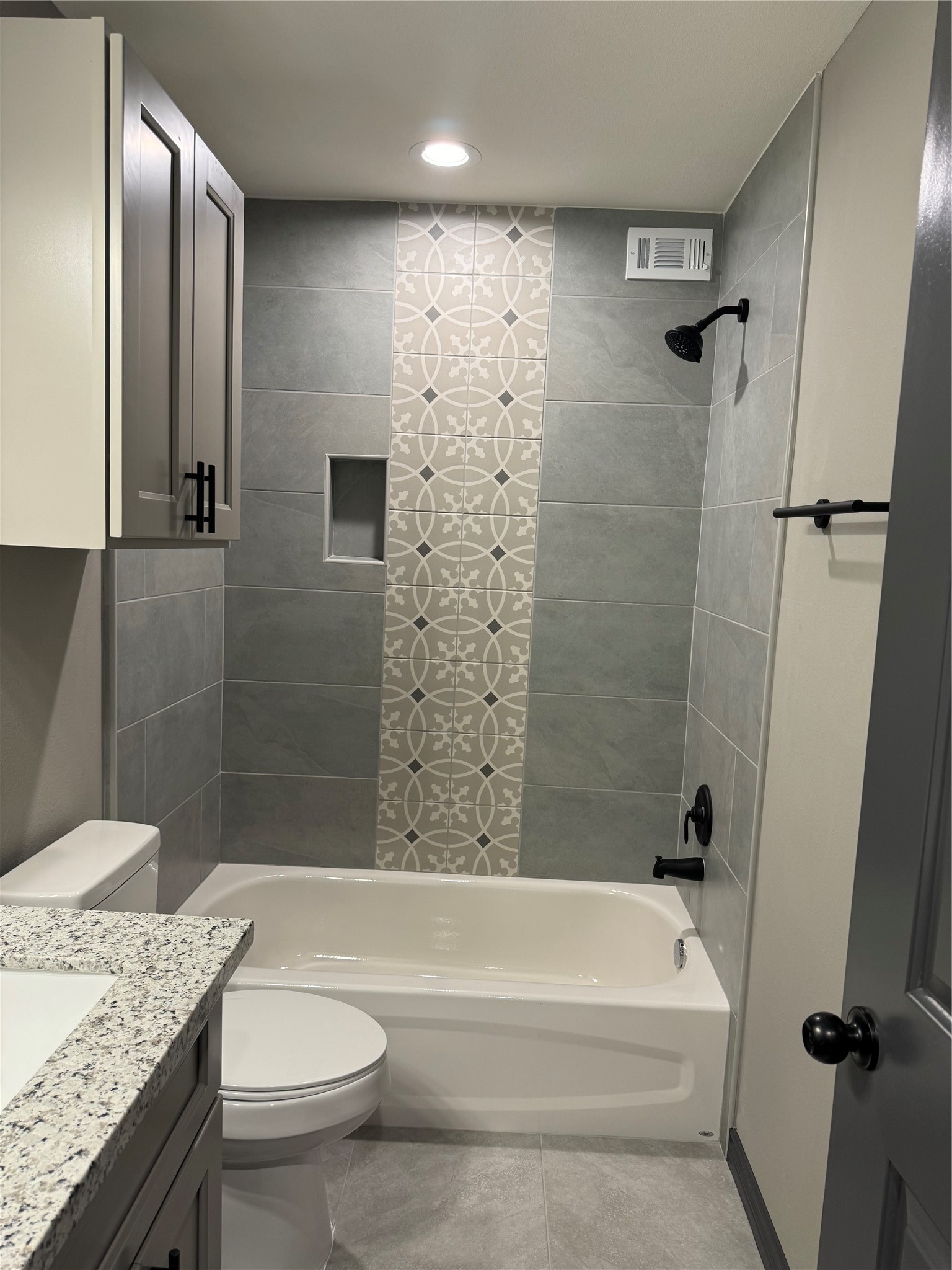 7906 Sexton Street Houston, TX 77028 - Photo 5 of 20 a bathroom with a granite countertop sink toilet and shower