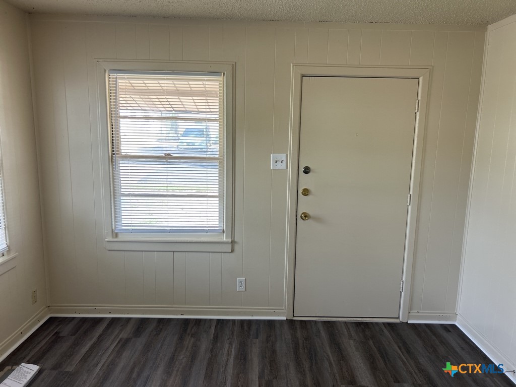 715 Cardinal Avenue Killeen, TX 76541 - Photo 2 of 12 an empty room with a closet and wooden floor