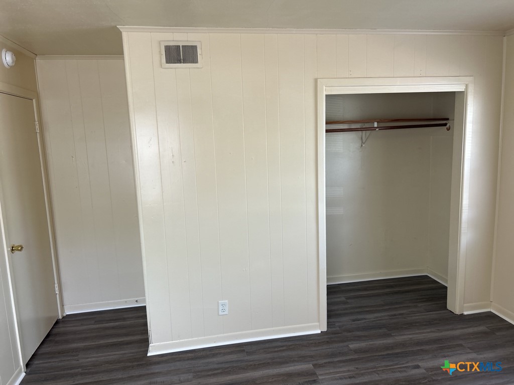 715 Cardinal Avenue Killeen, TX 76541 - Photo 8 of 12 a view of an empty room with wooden floor