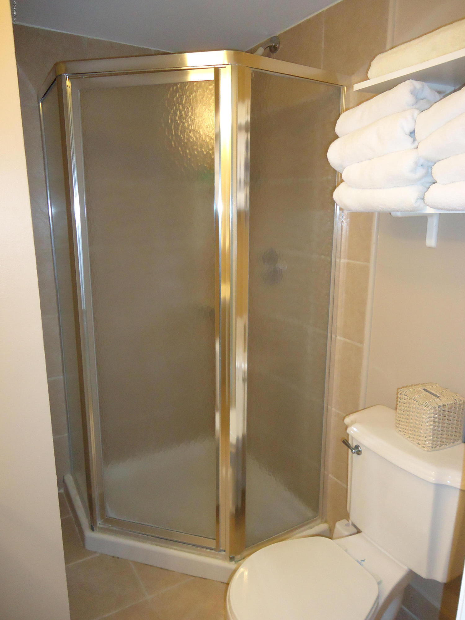 2233 Seminole Road, Unit 39 Atlantic Beach, FL 32233 - Photo 15 of 18 a bathroom with a shower and a toilet