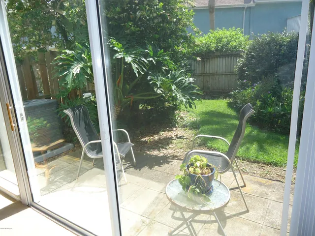 a view of a porch in the backyard
