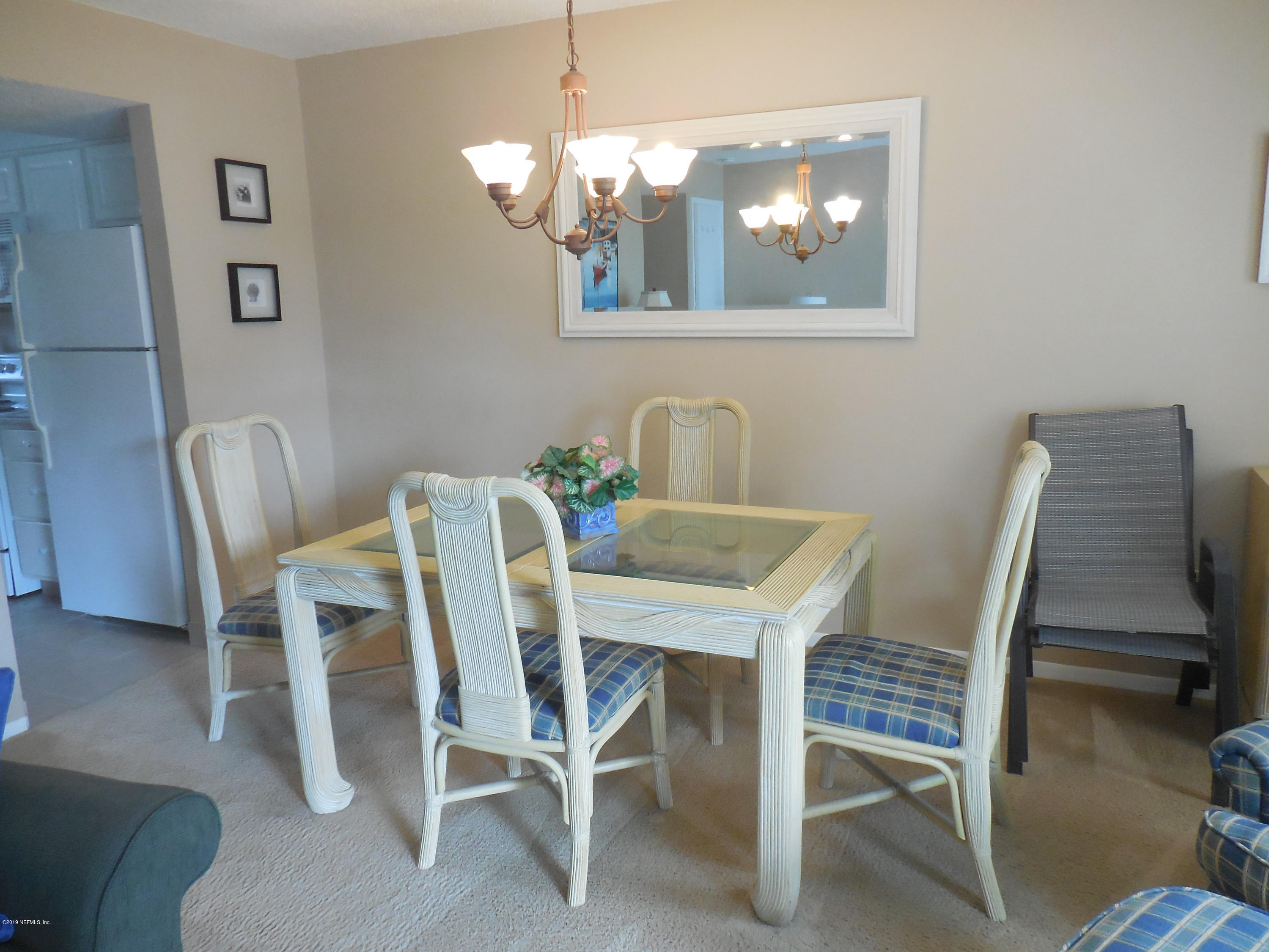 2233 Seminole Road, Unit 39 Atlantic Beach, FL 32233 - Photo 4 of 18 a dining room with furniture and window