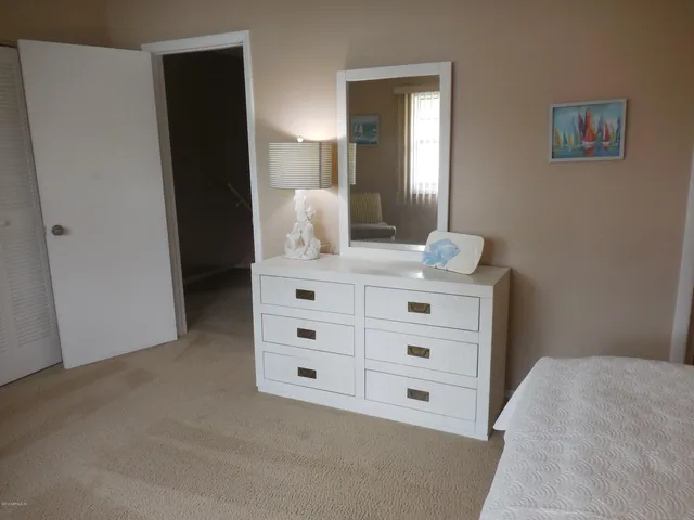 a bathroom with a sink vanity and mirror