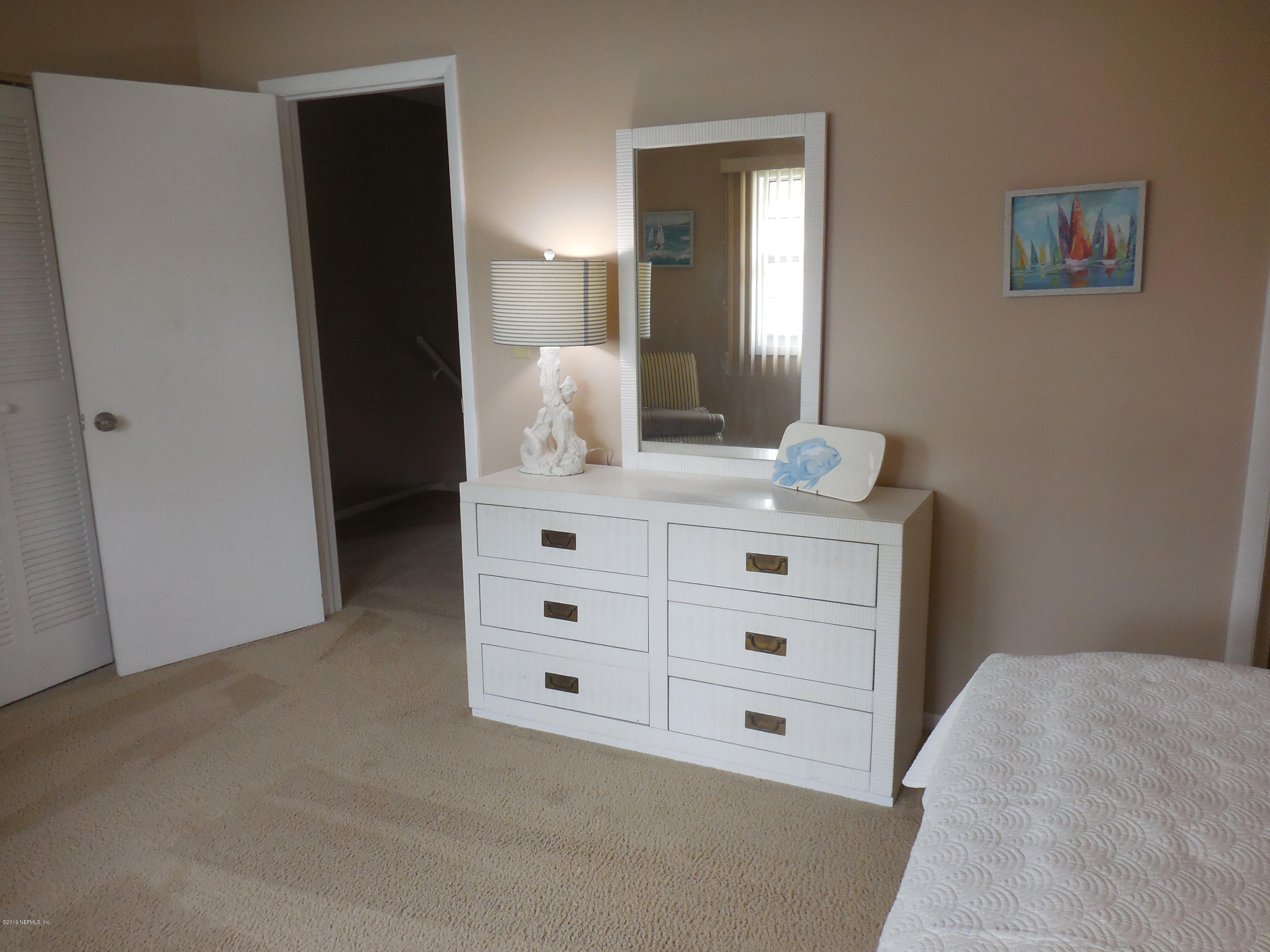 2233 Seminole Road, Unit 39 Atlantic Beach, FL 32233 - Photo 9 of 18 a bathroom with a sink vanity and mirror