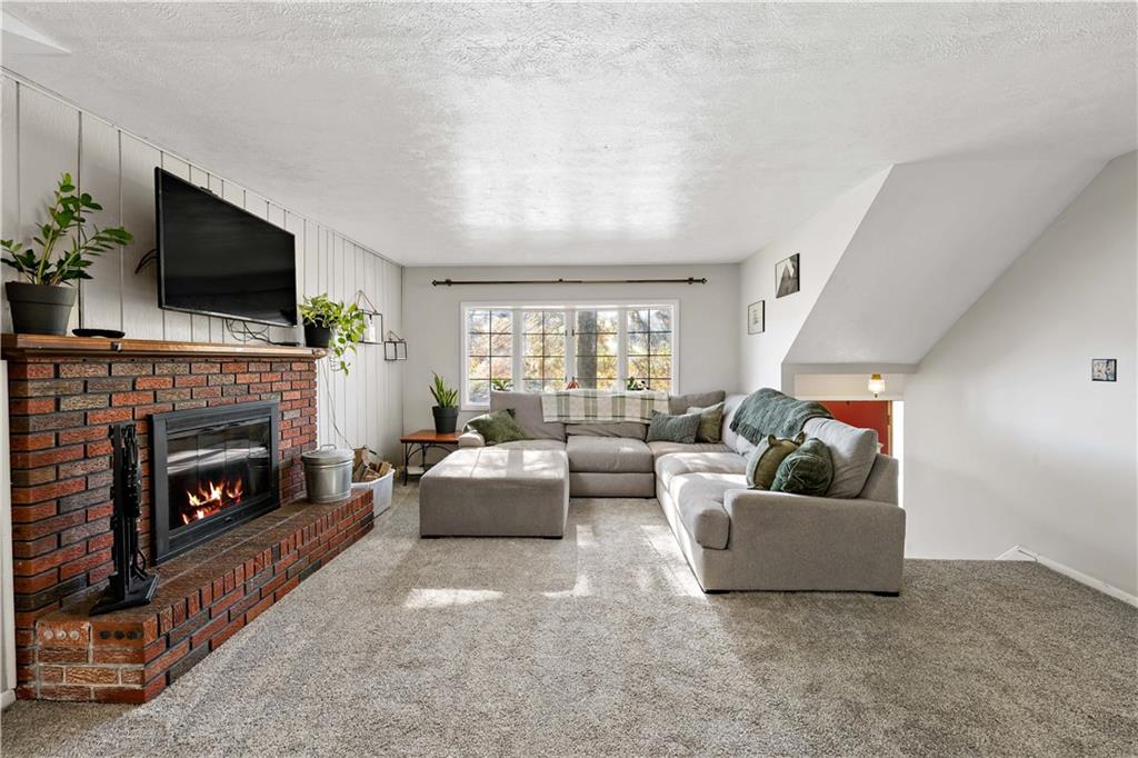 155 Brickyard Road Mars, PA 16046 - Photo 3 of 33 a living room with furniture and a fireplace