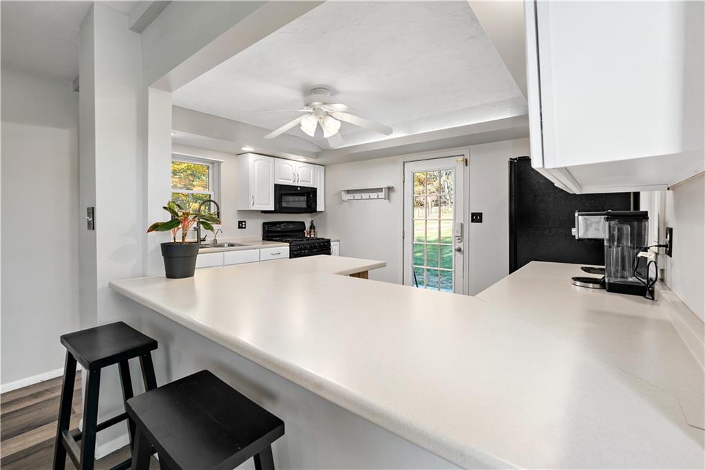 155 Brickyard Road Mars, PA 16046 - Photo 7 of 33 a large kitchen with a table chairs and refrigerator