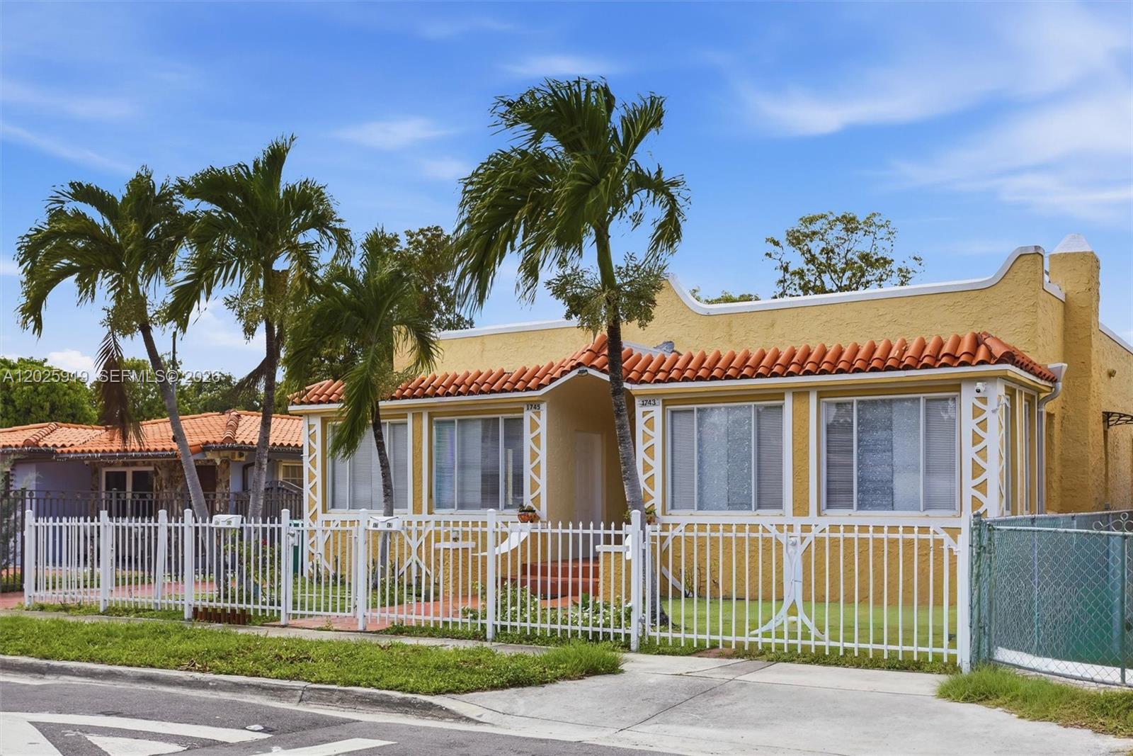 1743 Southwest 17th Street, Unit 1 Miami, FL 33145 - Photo 3 of 32 a front view of a house with a garden