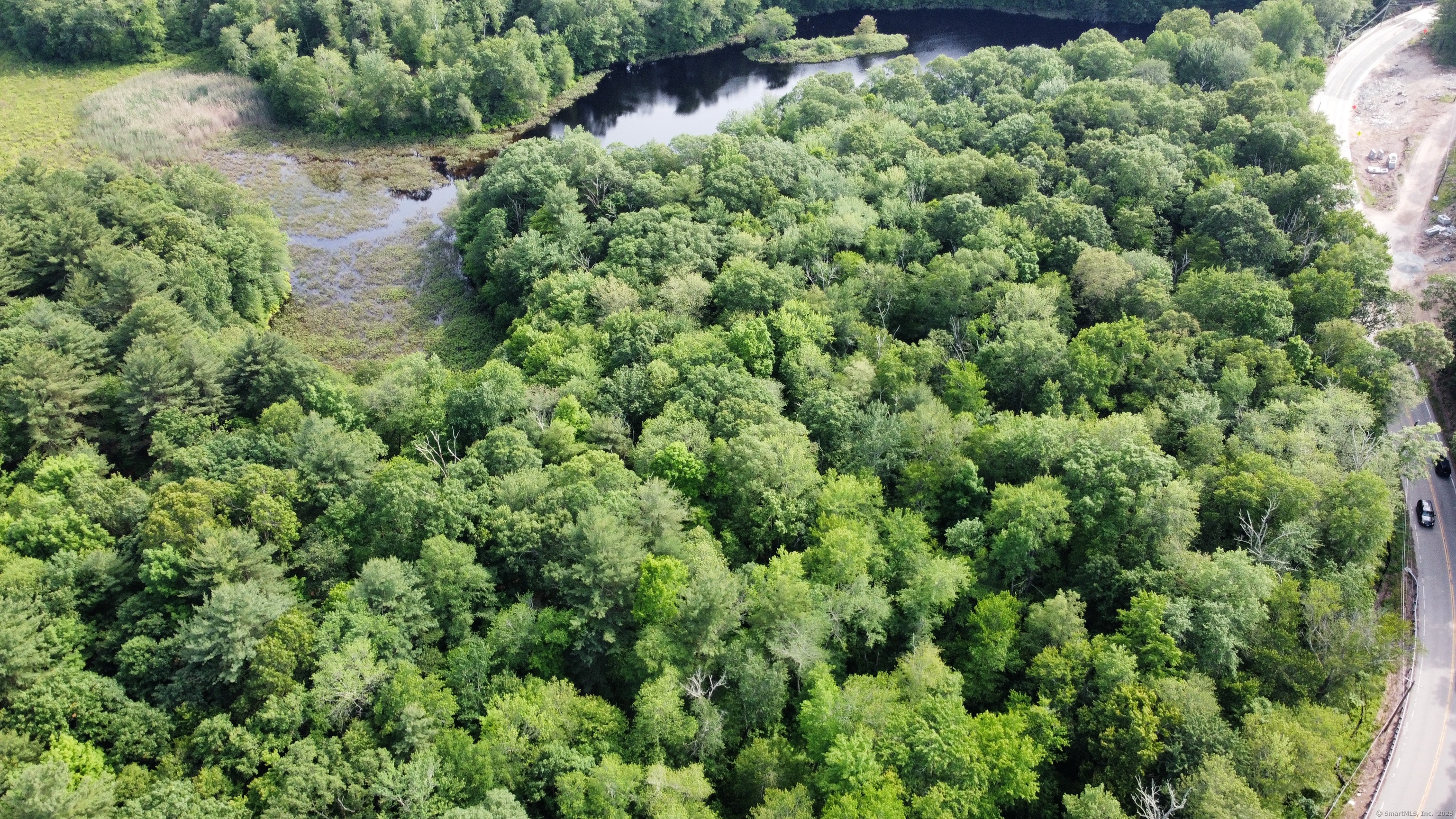 178 Crystal Lake Road Ellington, CT 06029 - Photo 16 of 27 an aerial view of a house with a yard and outdoor seating