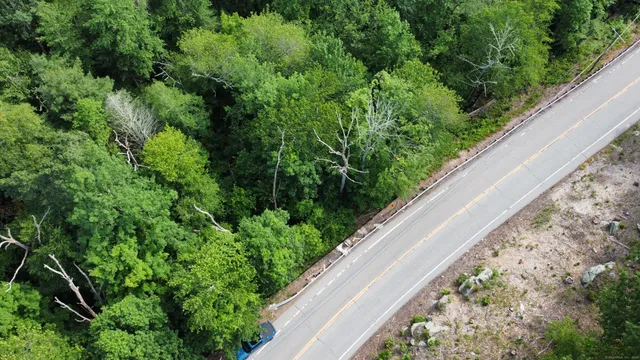 an aerial view of a house with mountain view