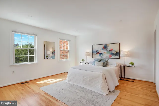 a bathroom with a sink mirror and toilet