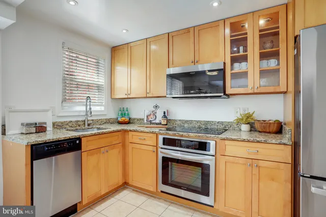 a kitchen with a refrigerator sink and microwave