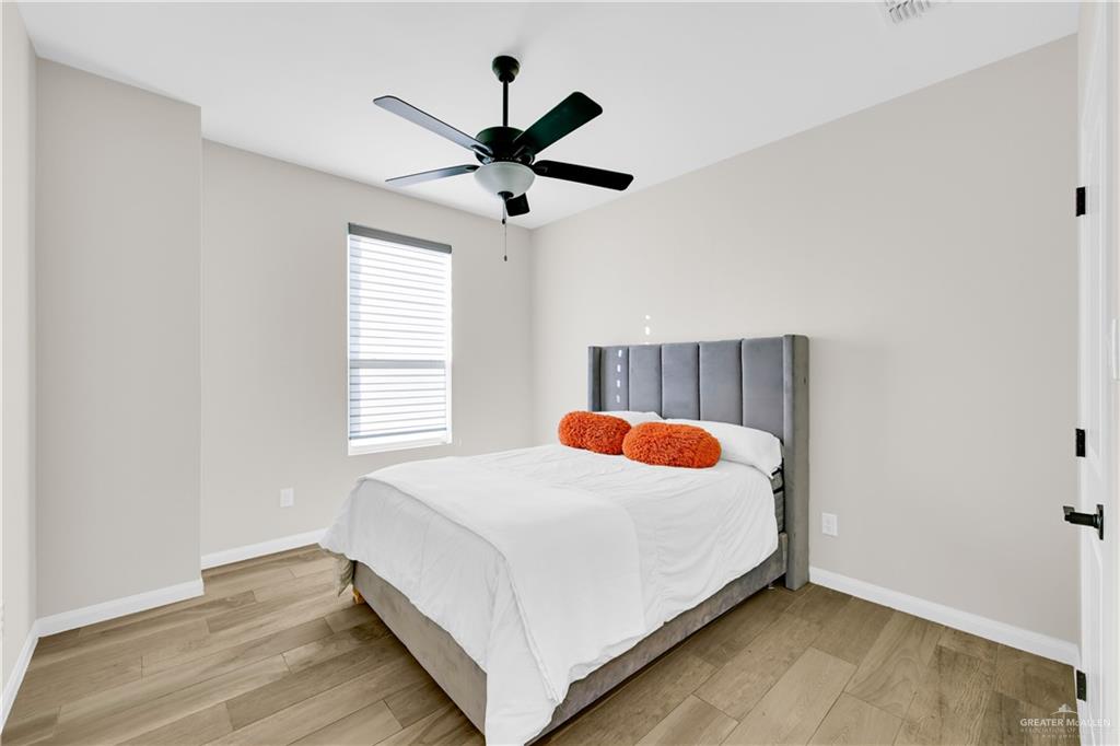 2514 Yarrow Street Mission, TX 78574 - Photo 13 of 22 Bedroom featuring light wood finished floors and a ceiling fan