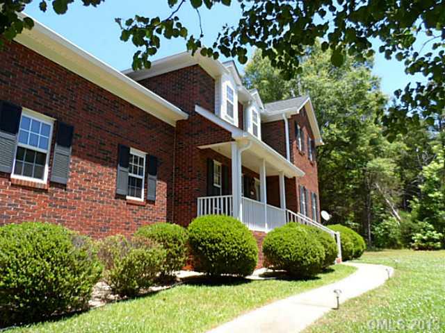 9922 Mini Ranch Road Waxhaw, NC 28173 - Photo 1 of 16 a front view of a house with a yard