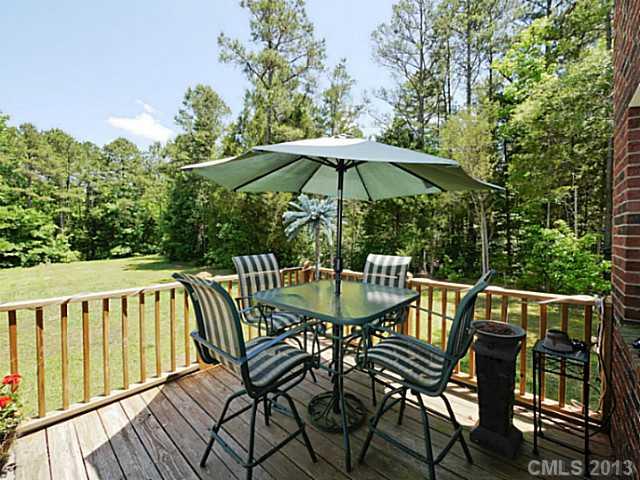 9922 Mini Ranch Road Waxhaw, NC 28173 - Photo 4 of 16 a view of balcony with wooden floor and outdoor seating