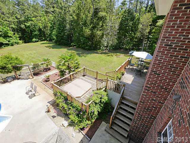 9922 Mini Ranch Road Waxhaw, NC 28173 - Photo 5 of 16 a view of a backyard with sitting area