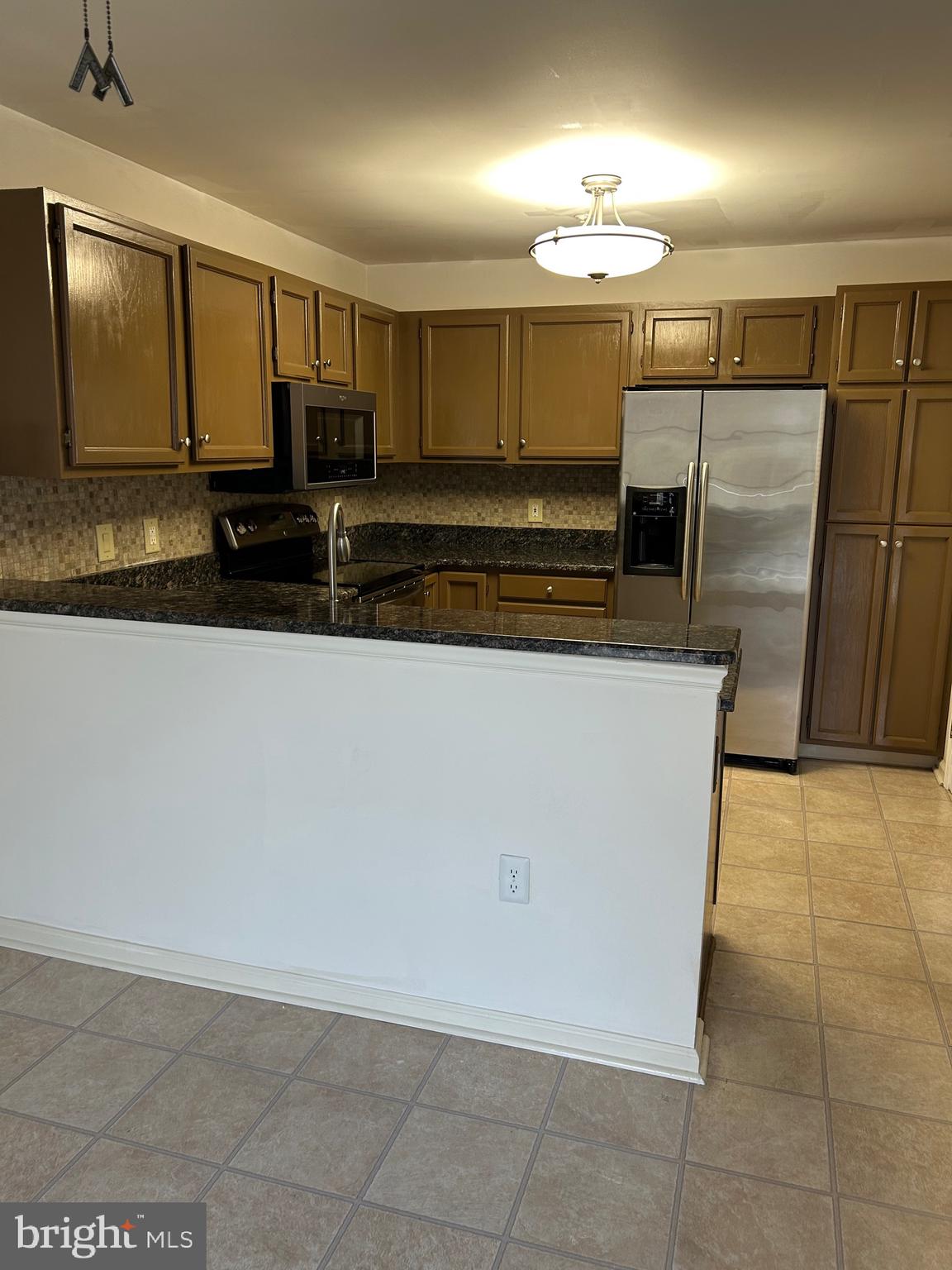 1201 Independence Way Newark, DE 19713 - Photo 11 of 24 a view of a refrigerator a sink and cabinets