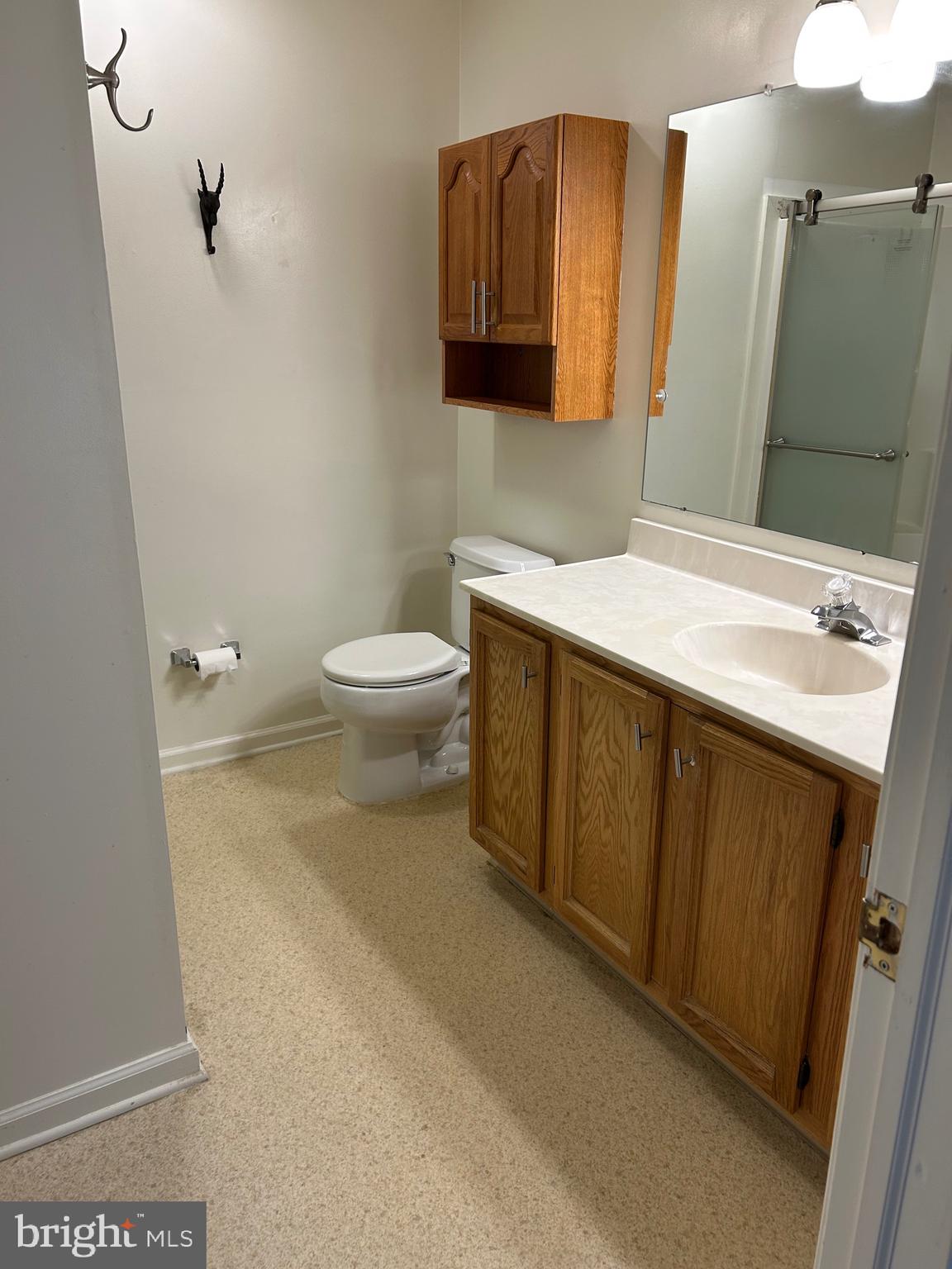 1201 Independence Way Newark, DE 19713 - Photo 18 of 24 a bathroom with a toilet sink and mirror