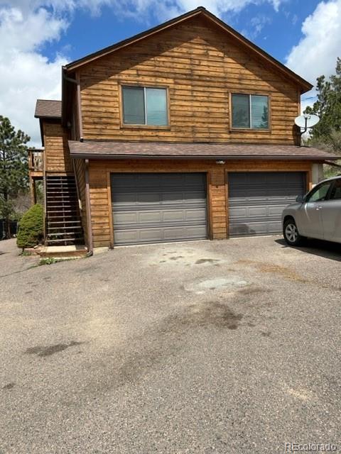 a front view of a house with garage