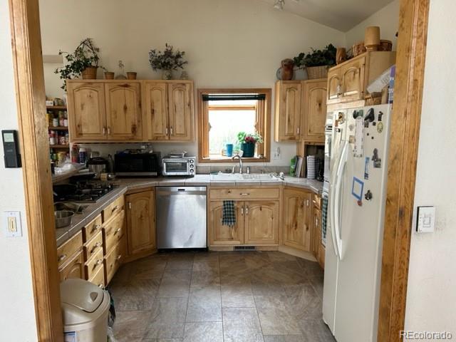 641 County Road 72 Bailey, CO 80421 - Photo 5 of 10 a kitchen with a sink stove and refrigerator