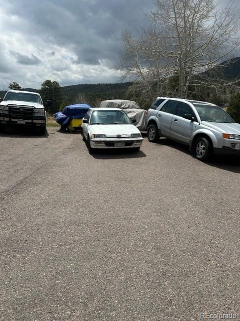 641 County Road 72 Bailey, CO 80421 - Photo 9 of 10 a view of cars parked in a parking lot