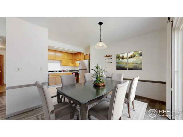 a kitchen with a table and chairs in it